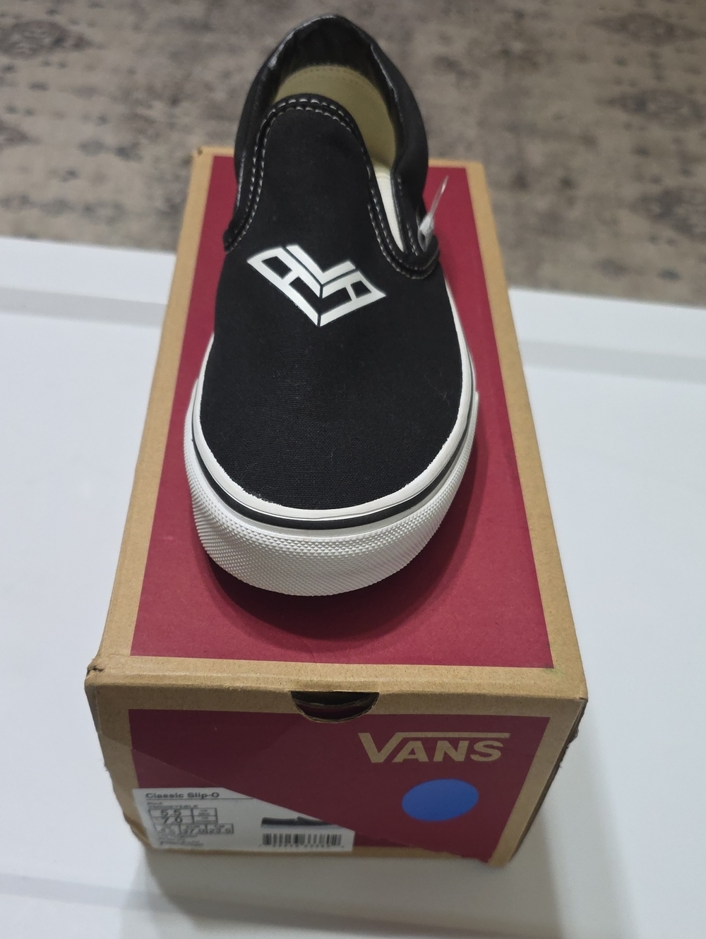 Vans Black Slip-On Womens Sneaker with White Logo